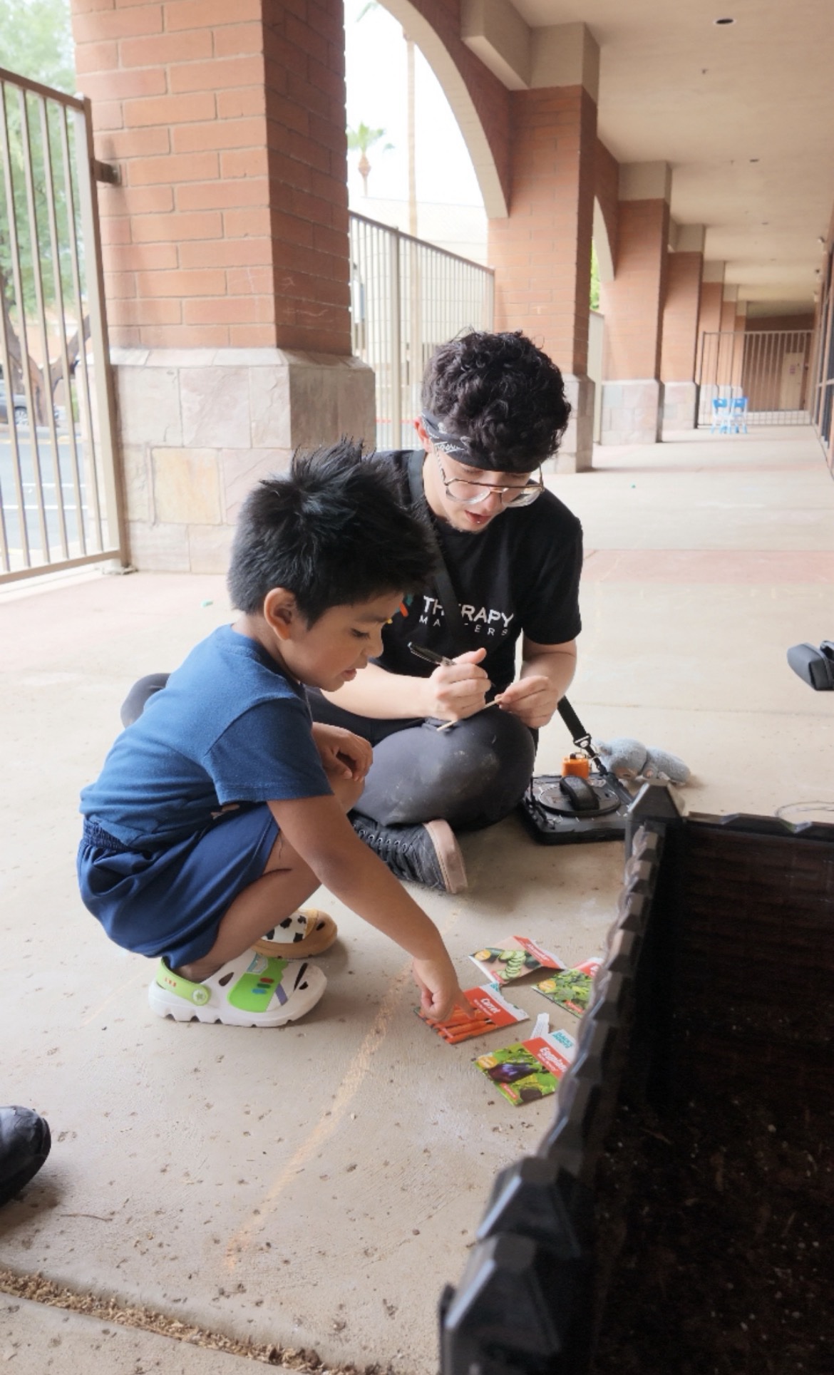 Kiddo choosing a seed to plant